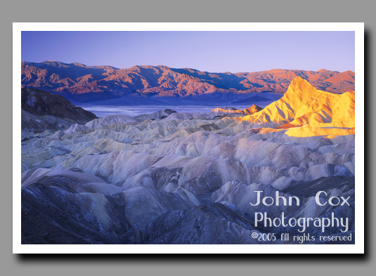 Death Valley's Manly Beacon glows brightly in the light of the rising sun.