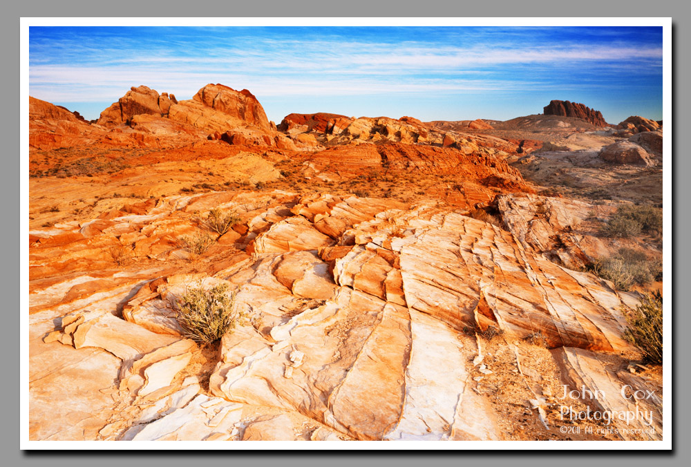 A colorful landscape set against blue skies in Valley of Fire State Park, Nevada.