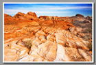 A colorful landscape set against blue skies in Valley of Fire State Park, Nevada.